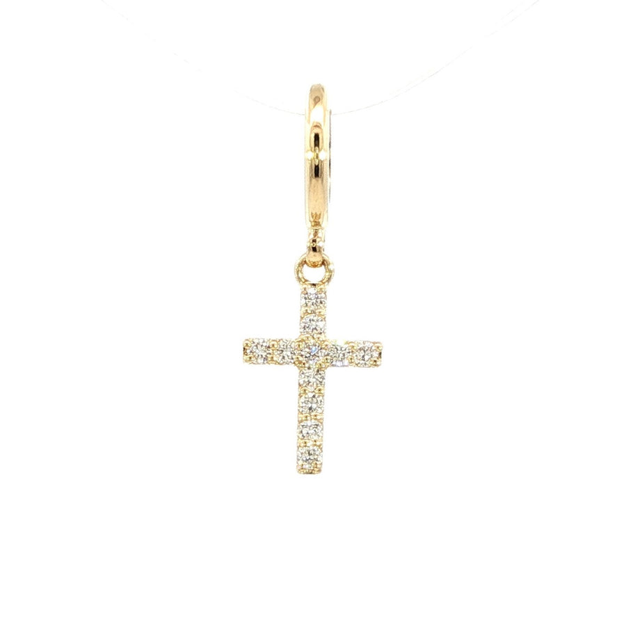 A close-up image of a gold pendant featuring round, brilliant-cut diamonds, displayed against a white background.
