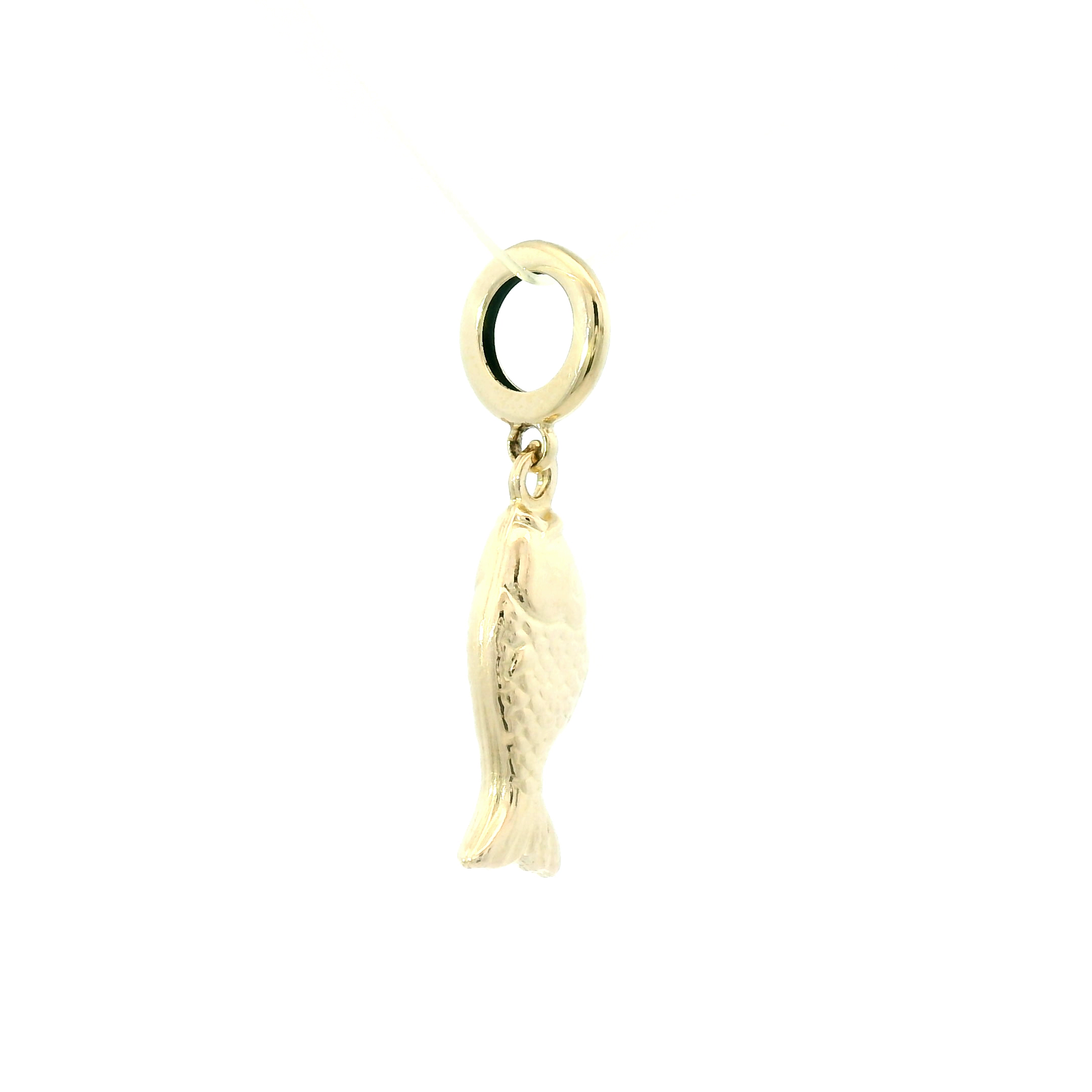 Gold fish charm on a white background