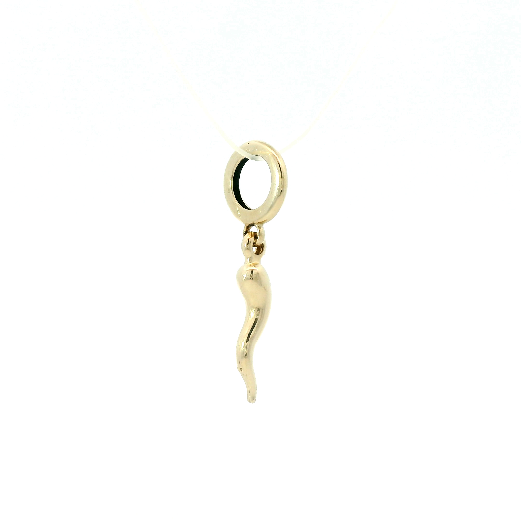 Gold charm shaped like a horn on a white background