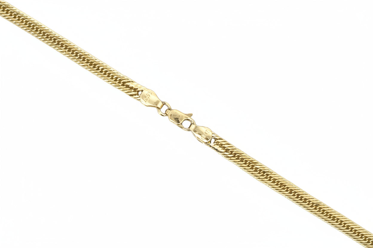 Gold chain necklace on a white background