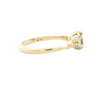 Gold ring with a gemstone on a white background